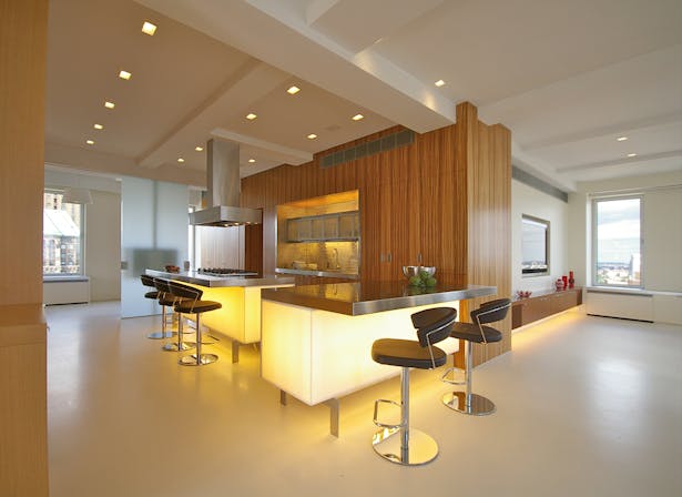 View of glowing kitchen from foyer
