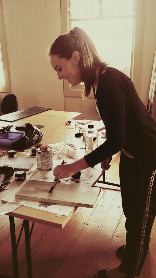 Hannah Smith painting a wall panel for the client presentation Mood Board